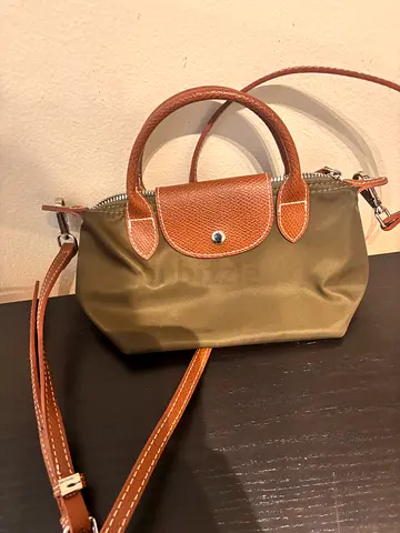 Small khaki nylon handbag with tan leather trim