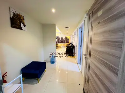 Al Majaz 2 Two bedrooms and living room with hotel-style furnishings 2 bathrooms balcony in the living room side view elegant and comfortable apartmen
