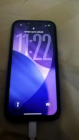 iPhone with case and charging cable - good working condition