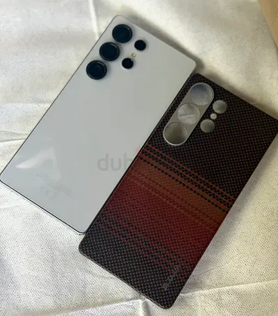 SAMSUNG S25 ultra 256 gb with cases — white Samsung-like phone and patterned case (for sale)