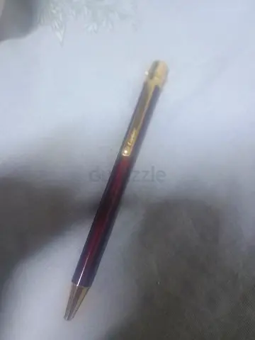 Vintage-style gold-trim ballpoint pen in burgundy — good condition