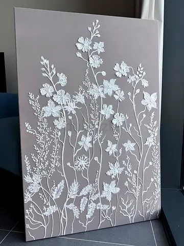A botanical bas‑relief painting