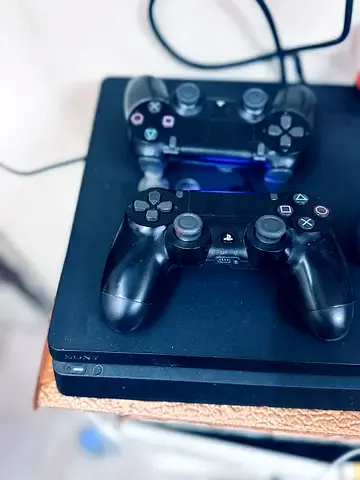 Sony PlayStation 4 Slim with Two Controllers
