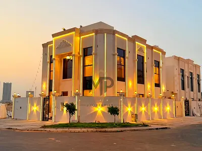 Villa for sale in Ajman | Al Helio 2 area | 5 bedrooms, majlis, 2 living rooms, and a roof terrace | Freehold | Price includes registration fees and i