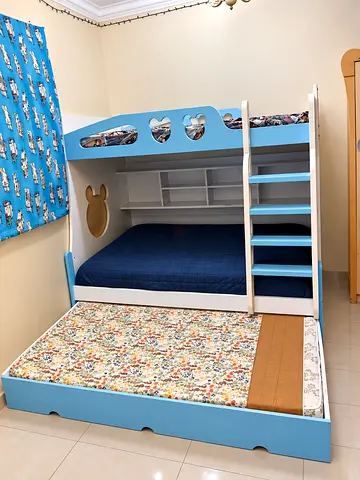 Blue wooden bunk bed with trundle and storage - good condition