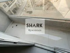 Brand-new 1BR apartment in Al Jurf 3, Ajman. Spacious living room, balcony, 2 baths, central AC and 