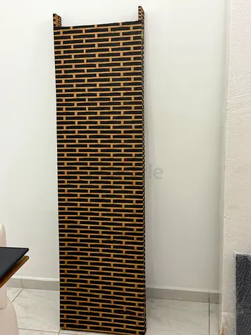 Tall wooden room divider/shelf with woven pattern - good condition