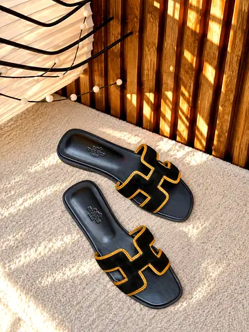 Black suede slide sandals with gold trim - women’s size (preowned)