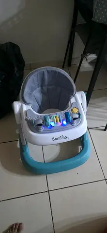 Lightweight baby activity walker with seat and toys - good condition