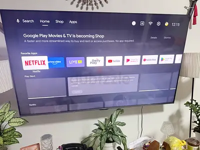 65-inch Smart LED TV mounted, good working condition