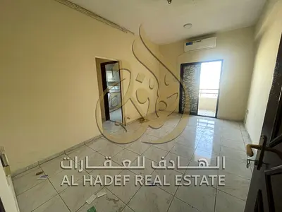A great opportunity to rent a comfortable 2-bedroom apartment in Al Shuwaihean, featuring a company contract, balcony with an open view, split AC, and