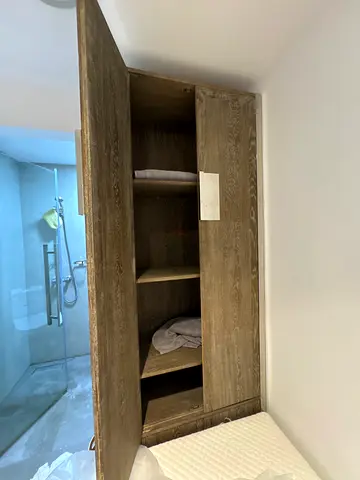 Single white wooden bed frame with mattress with attached wardrobe - good condition