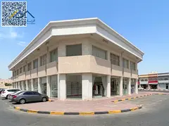 Commercial Building for Sale in Ajman | 2nd Plot from Sheikh Ammar St | 18 Shops + 3 Studios | AED 9