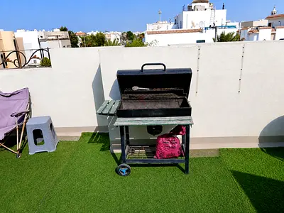Used outdoor charcoal BBQ grill on wheeled stand