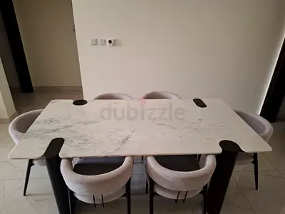 Marble-top dining table with 6 upholstered chairs
