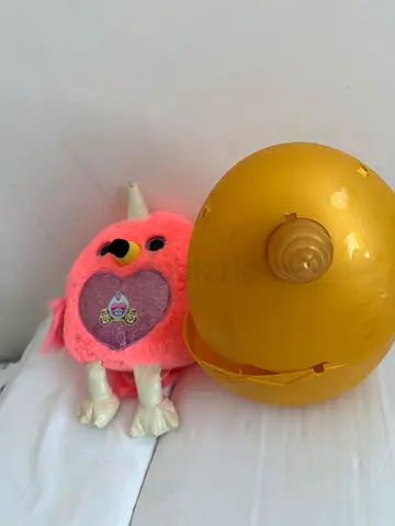Pink fluffy collectible surprise toy with golden capsule - used