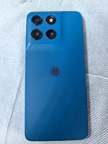 Motorola G57 smartphone - good condition, blue back, triple camera