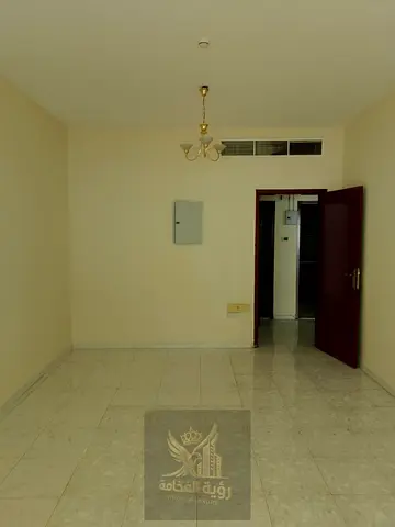 Family apartment for annual rent in Al Majaz 3, Sharjah | 2 bedrooms and a living room with a balcony, 2 bathrooms, and built-in wardrobes; priced at