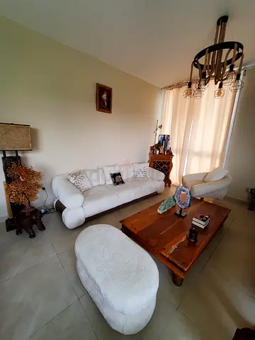 White 3-seater sofa set with ottoman and wooden  table and wooden bar