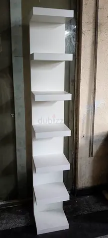 Tall white multi-tier display shelf / storage unit — 7 tiers