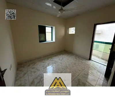 Spacious 1BR in Al Rashidiya 1, balcony, near Fish Market, no AC, AED 22,008/year, 4 or 6 payments.