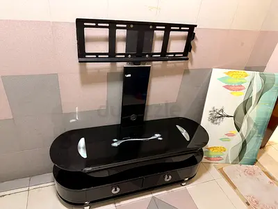 Black glossy TV entertainment unit with storage drawers