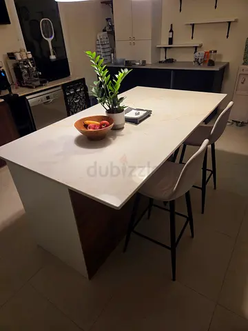 Modern kitchen island with marble top and 2 bar stools