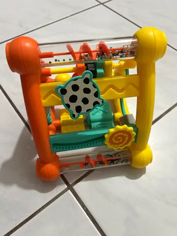Bright plastic activity cube toy with rollers and beads