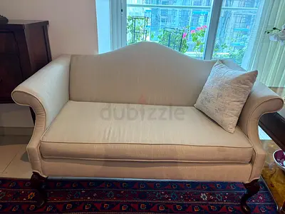 Silver sofa set with wooden legs — one four seater two love seats good condition