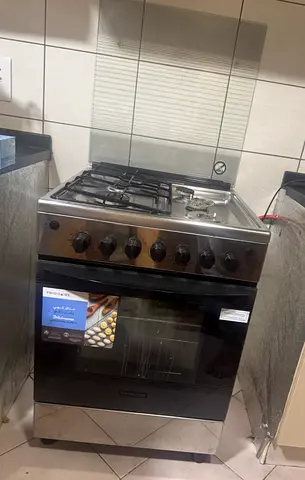 Used freestanding stainless steel gas stove with oven - good condition