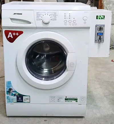 Coin operated washing machine system available for labour camp residential buildings and villas