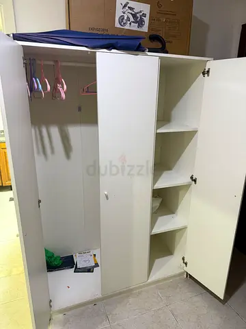 White 3-door Well-maintained wooden storage cabinet available for sale. Ideal for bedroom, office