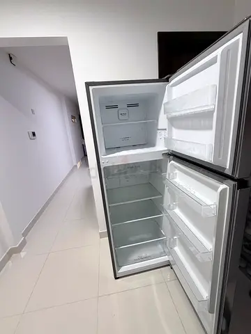 Used double-door refrigerator in good working condition