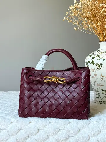 Burgundy Woven Leather Top-Handle Handbag with Gold Knot Detail