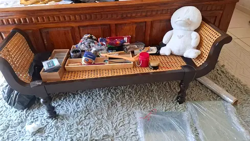 Wooden cane bench with woven seat — good condition