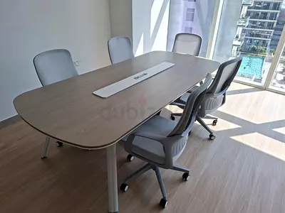 Wooden meeting table with 4 ergonomic office chairs - good condition