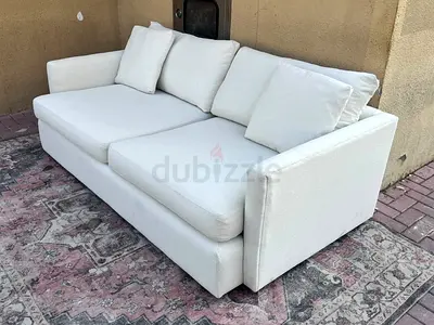 Available high quality crate and barrel three setter sofa