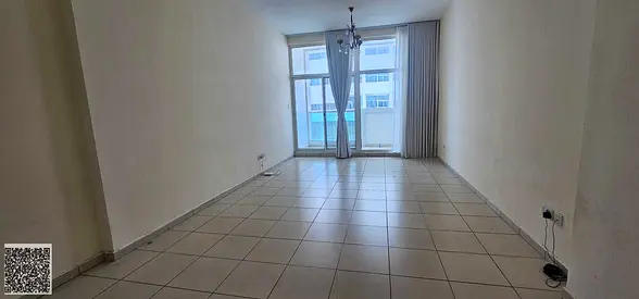 A spacious 2-bedroom apartment with a living area (2BHK) and a partial view is available for rent in Tower 7.