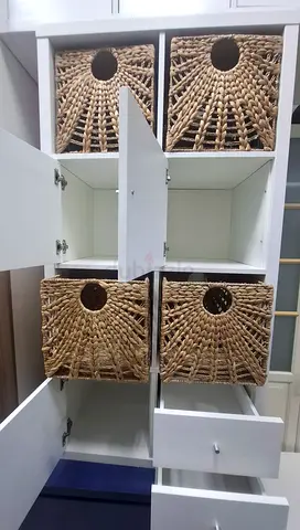 White storage cabinet with woven rattan baskets - good condition