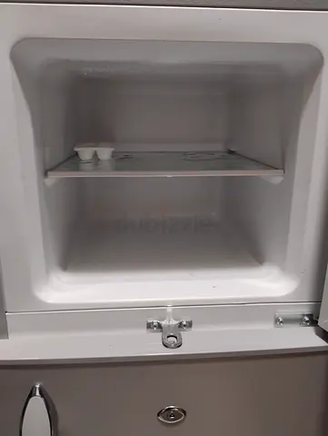 Small built-in freezer compartment — good working condition