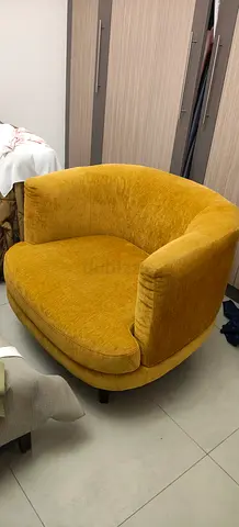Large mustard yellow swivel lounge chair in good condition