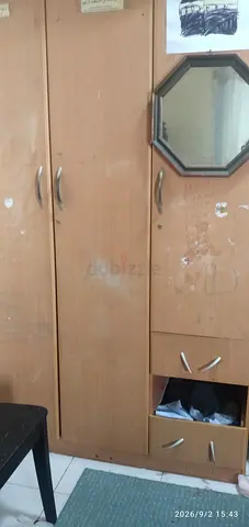 Used tall wooden wardrobe with mirror - good for bedroom or storage