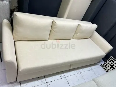 Cream Three-Seater Sofa with Back Cushions