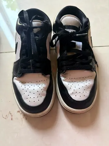 Used black and white sneakers - size unknown, casual wear