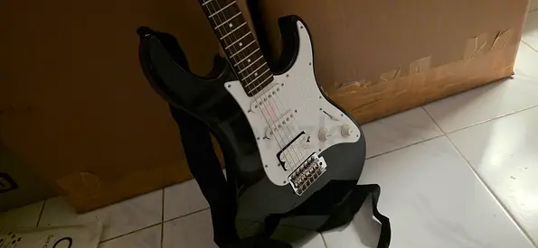 Yamaha black electric guitar (Strat-style) with strap and bag