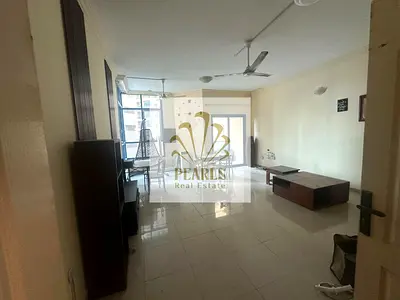 For sale in Al Khor Towers: a unit featuring two bedrooms, a living room, two balconies, and a maid's room. Spacious layout in the heart of Ajman;