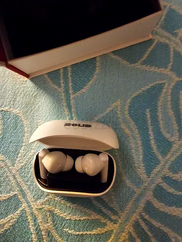 White wireless earbuds with charging case - lightly used