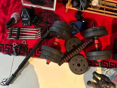 Adjustable dumbbell set with weight plates and bar - used
