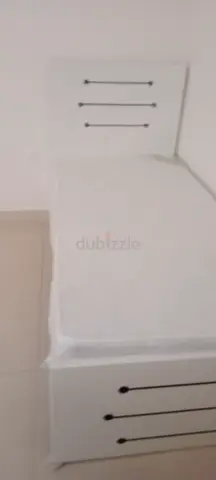Single white bed frame with mattress