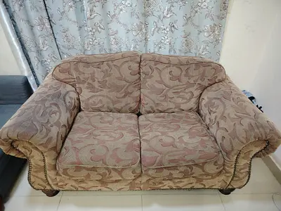 Two-seater patterned fabric sofa in good used condition